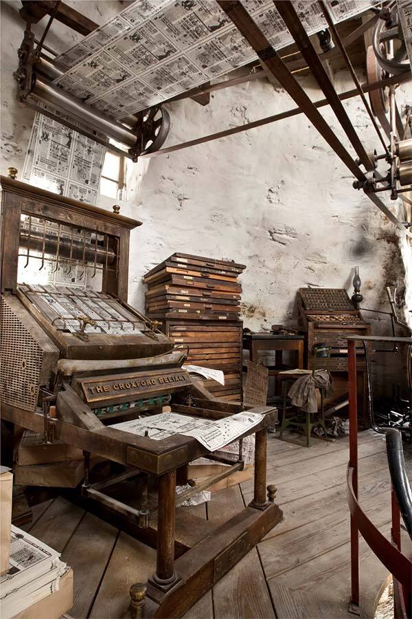 A photograph of an old printing press